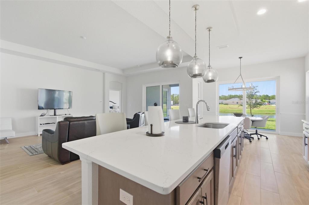 21 Spring Street Palm Coast, FL 32164 - Photo 22 of 57 a large kitchen with kitchen island a large island in it