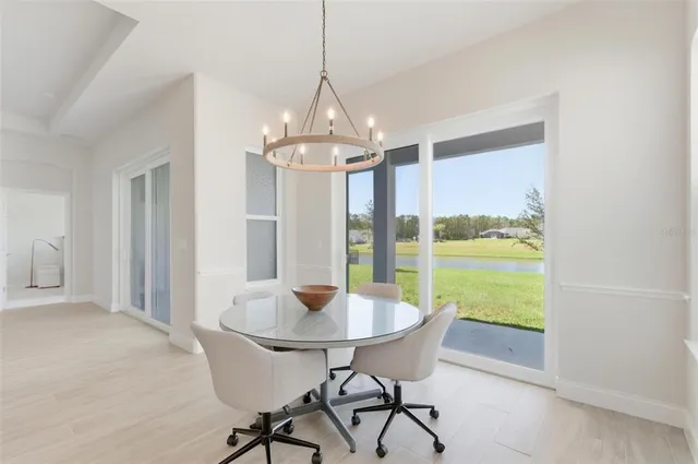 a large kitchen with a table and chairs