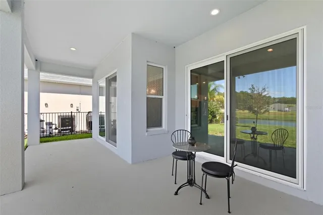 a spacious bathroom with a double vanity sink toilet and a mirror