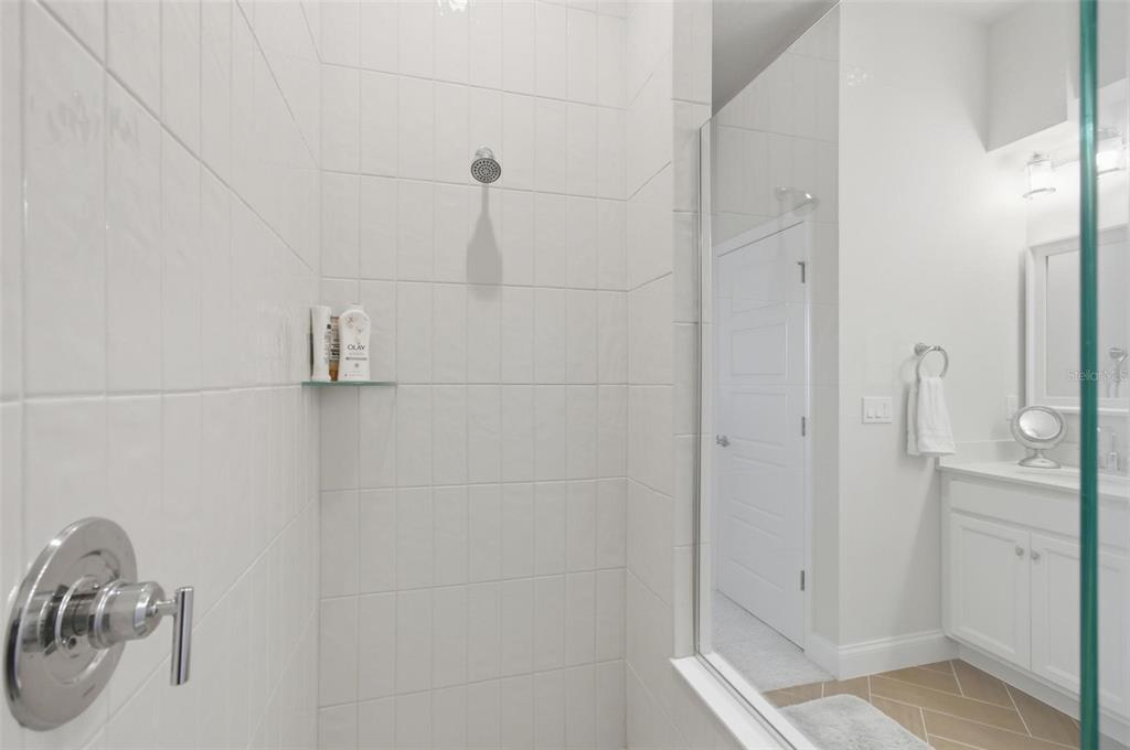 21 Spring Street Palm Coast, FL 32164 - Photo 36 of 57 a bathroom with a shower