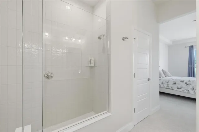 a view of a storage and utility room with washer and dryer