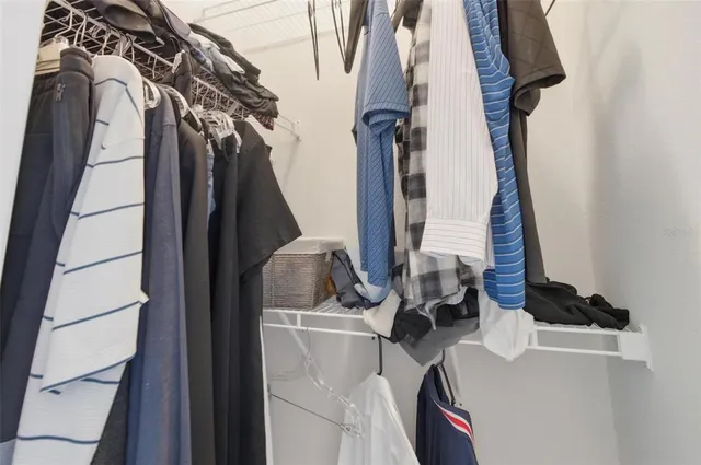 a view of storage and utility room with racks on the wall