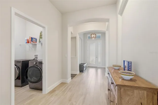 a bathroom with a sink toilet tub vanity and shower