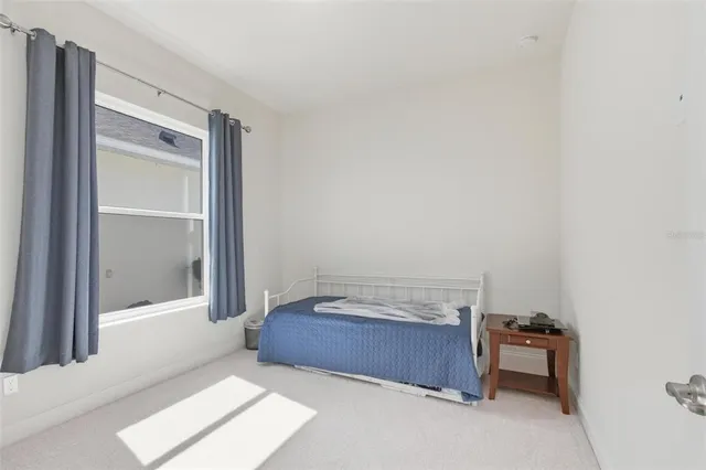 a view of a workspace with a window and chair
