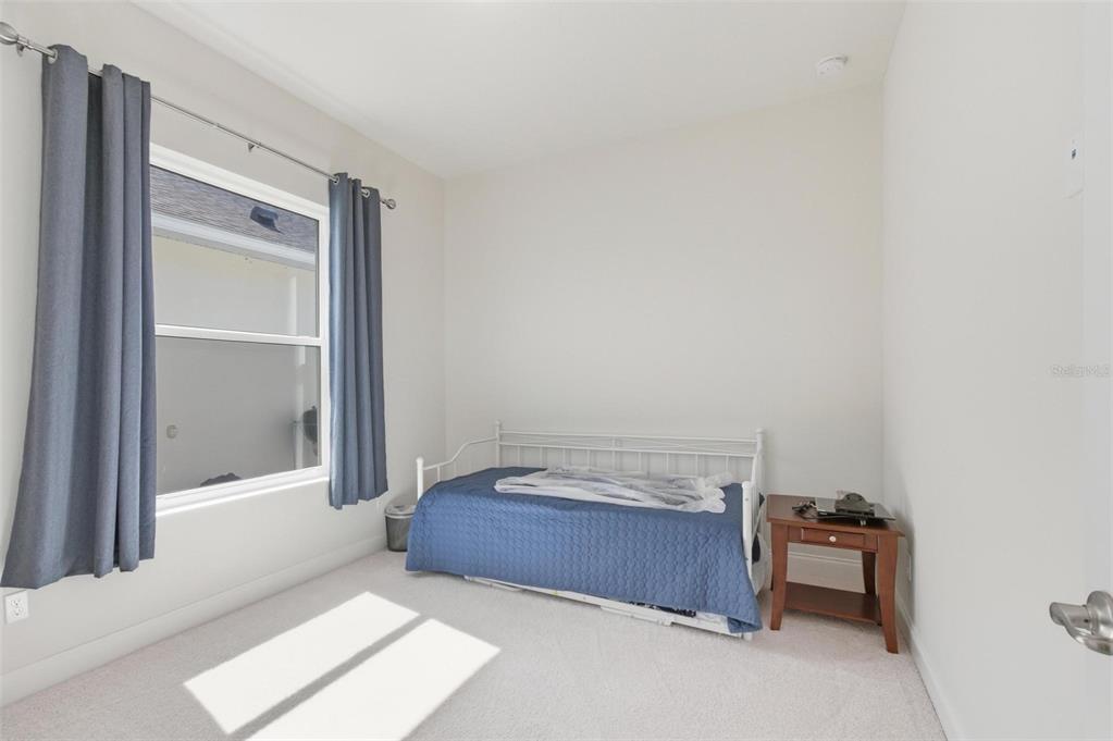 21 Spring Street Palm Coast, FL 32164 - Photo 45 of 57 a room with a bed and a window