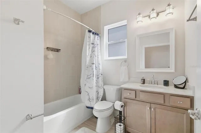 a view of a lake with houses in the back