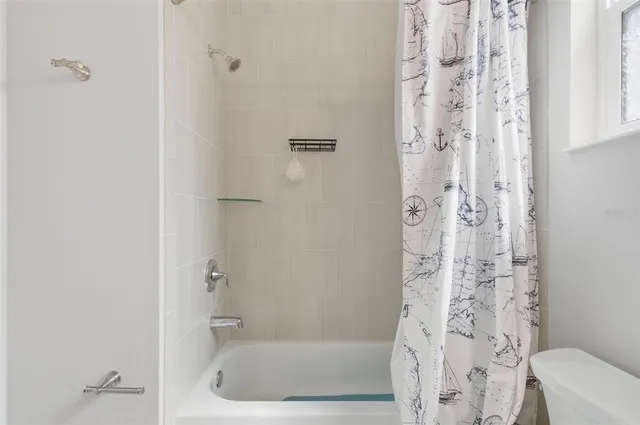 a view of house with backyard space and balcony