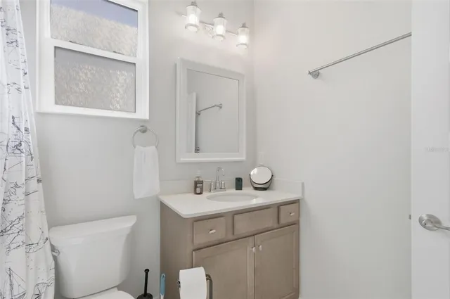 a view of a house with sitting area and garden