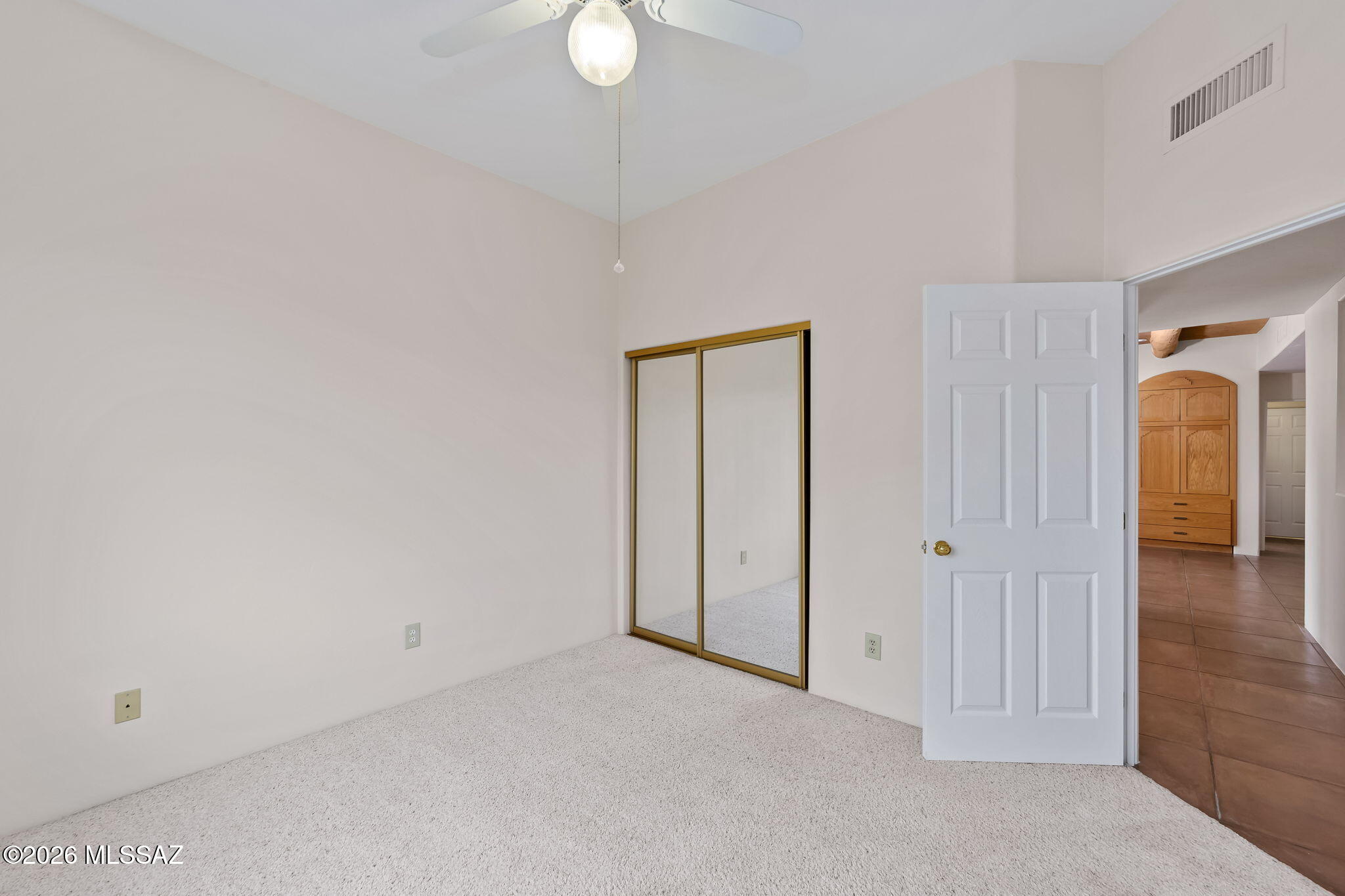 3655 North Harrison Road Tucson, AZ 85749 - Photo 31 of 51 an empty room with mirror