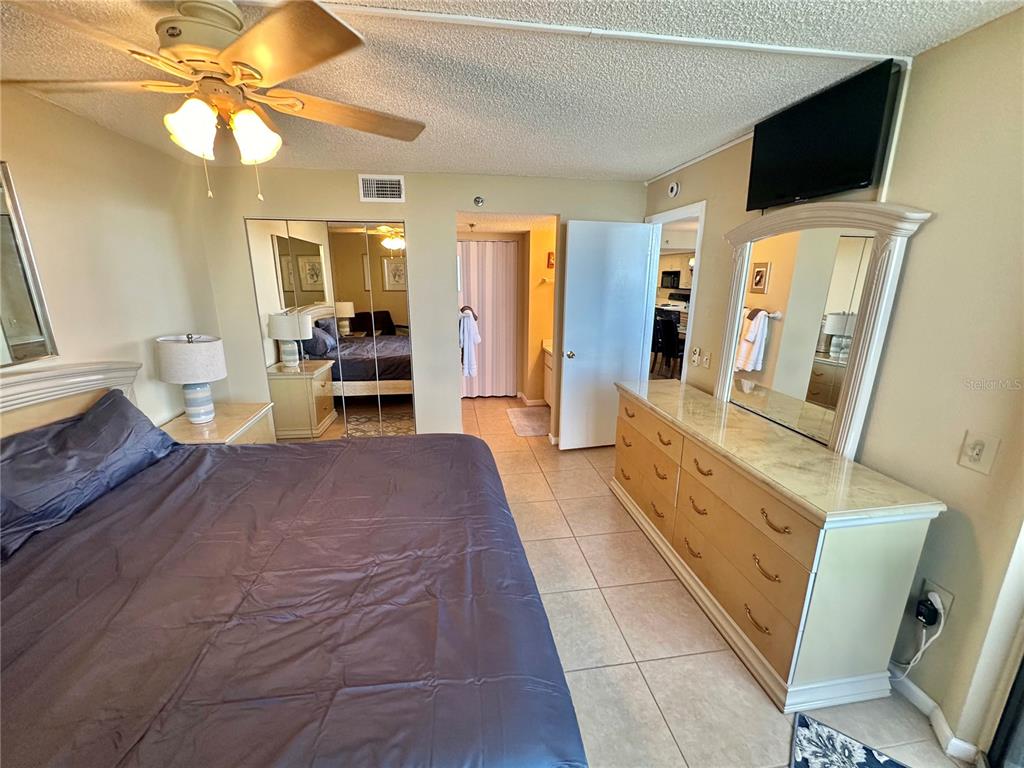 6009 Sea Ranch Drive, Unit 707 Hudson, FL 34667 - Photo 18 of 61 a living room with furniture a flat screen tv and a fireplace