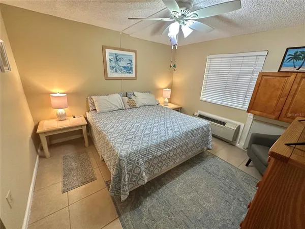 a living room with furniture rug and window