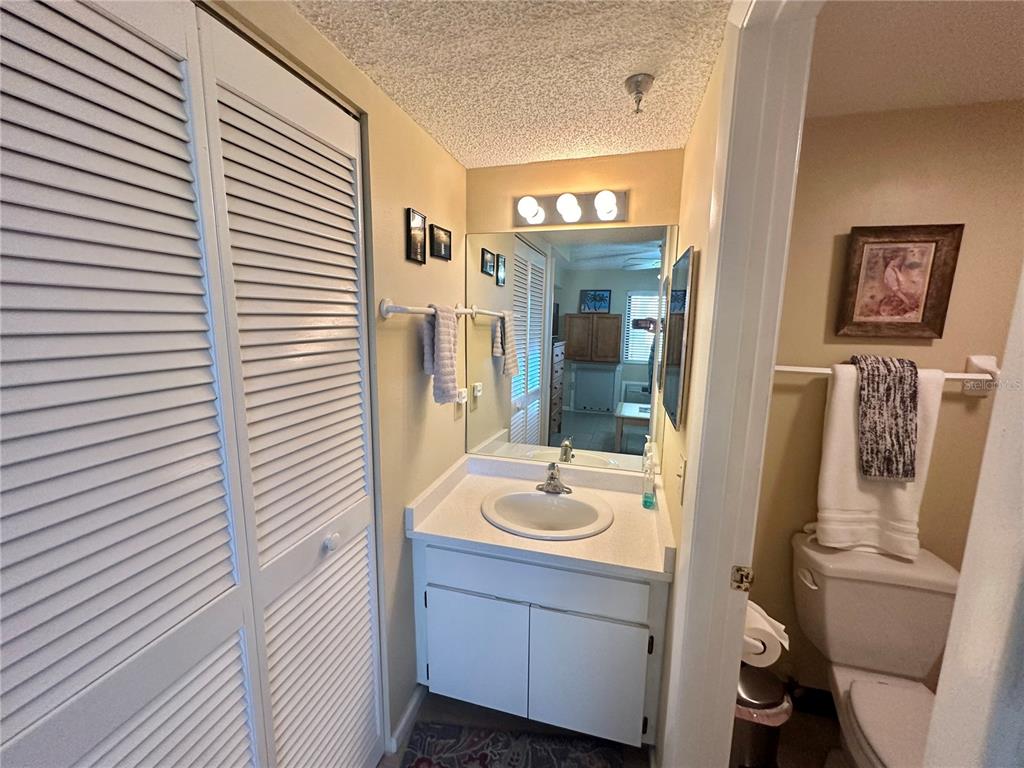 6009 Sea Ranch Drive, Unit 707 Hudson, FL 34667 - Photo 22 of 61 a bathroom with a sink a mirror and a shower