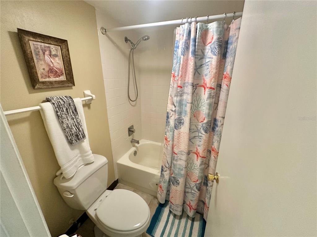 6009 Sea Ranch Drive, Unit 707 Hudson, FL 34667 - Photo 23 of 61 a white toilet sitting next to a bathroom sink