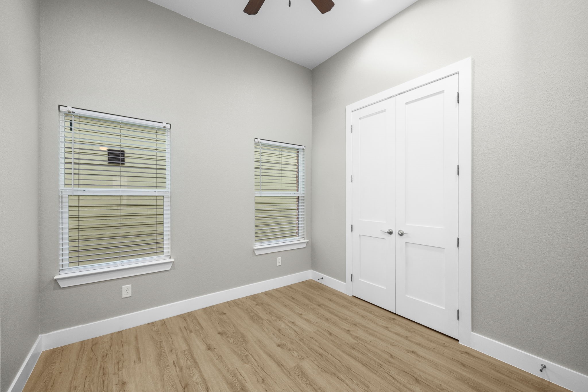 2310 Detering Street, Unit A Houston, TX 77007 - Photo 13 of 21 a view of an empty room with wooden floor and a window