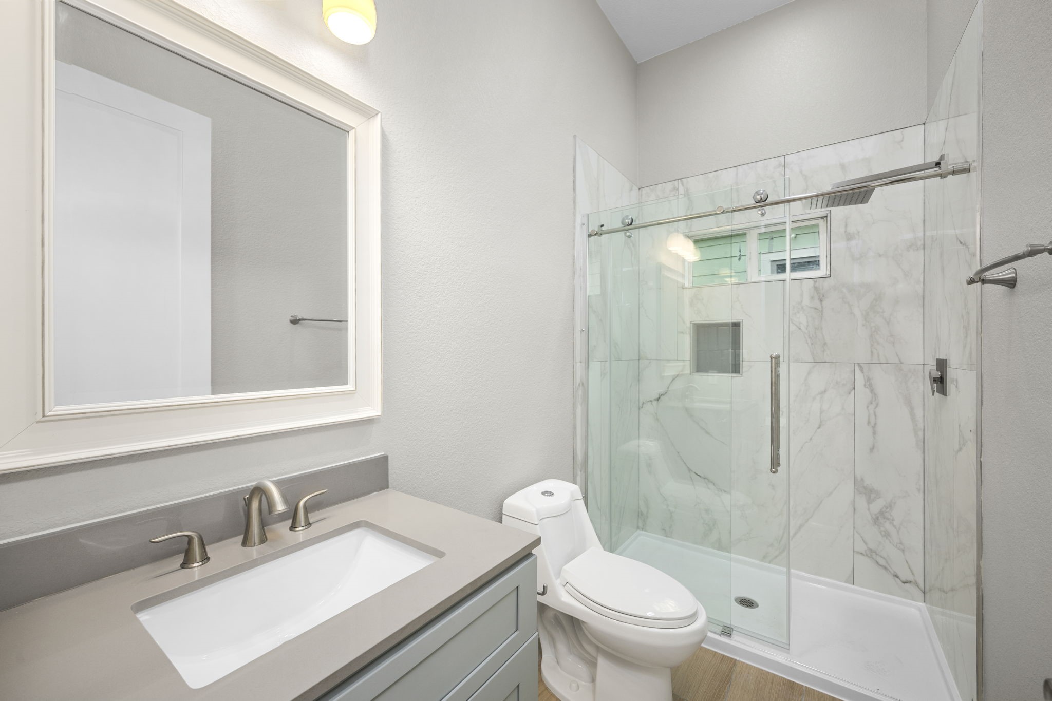 2310 Detering Street, Unit A Houston, TX 77007 - Photo 14 of 21 a bathroom with a sink toilet and shower