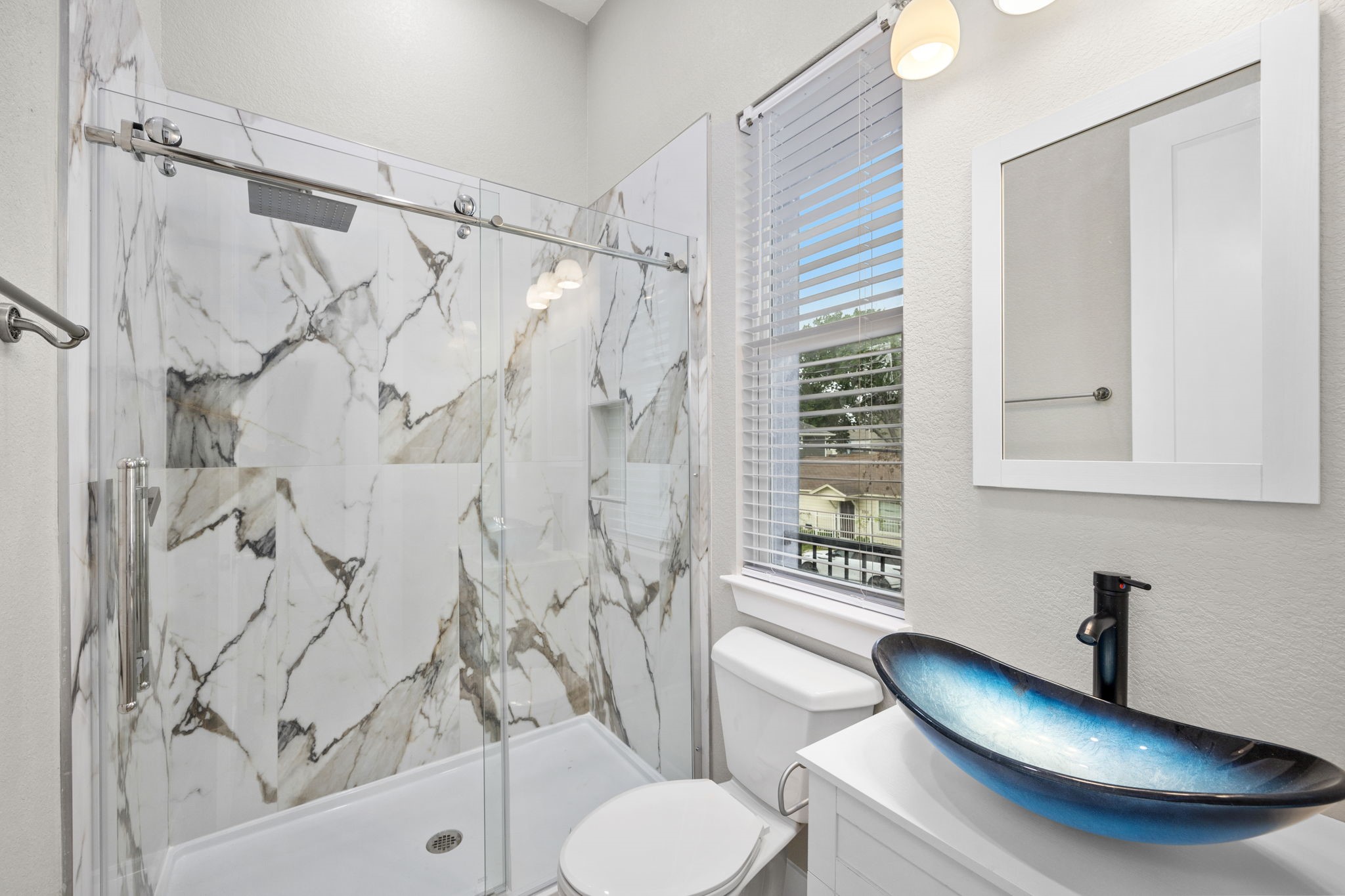 2310 Detering Street, Unit A Houston, TX 77007 - Photo 16 of 21 a bathroom with a sink toilet and shower