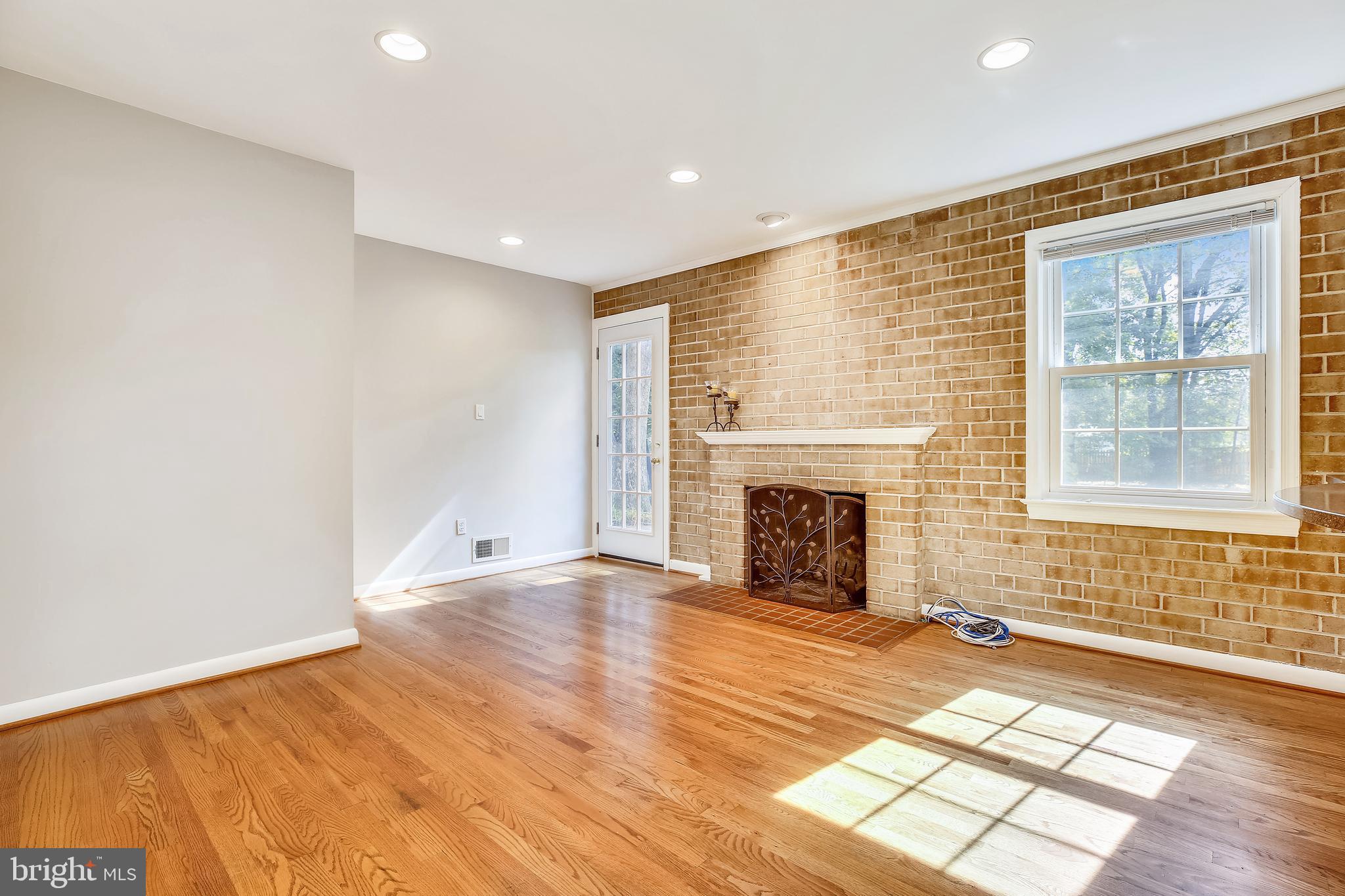 1593 Kimblewick Road Potomac, MD 20854 - Photo 5 of 45 a view of an empty room with window and fire place