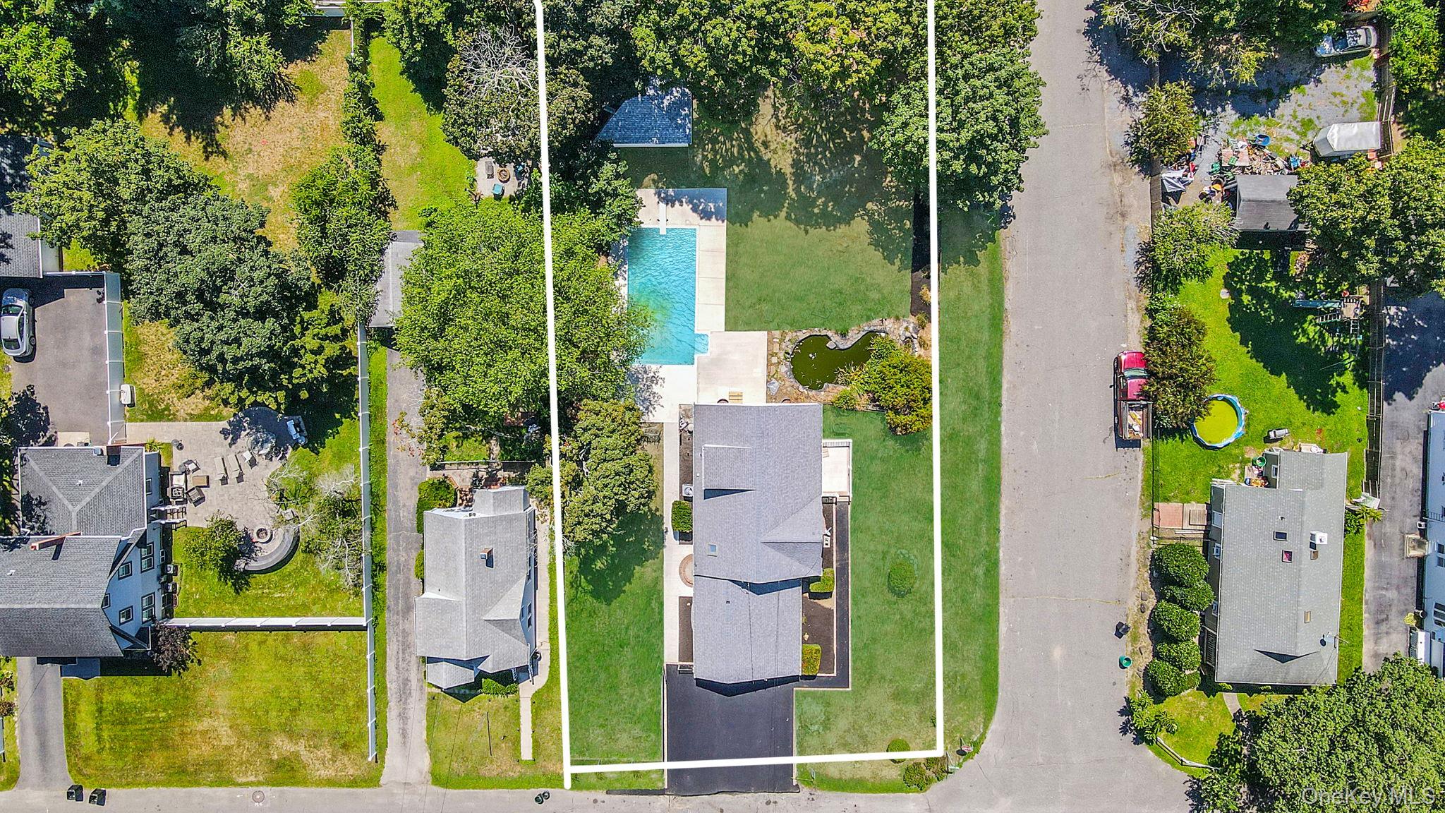 Aerial view of residential area with property boundaries highlighted