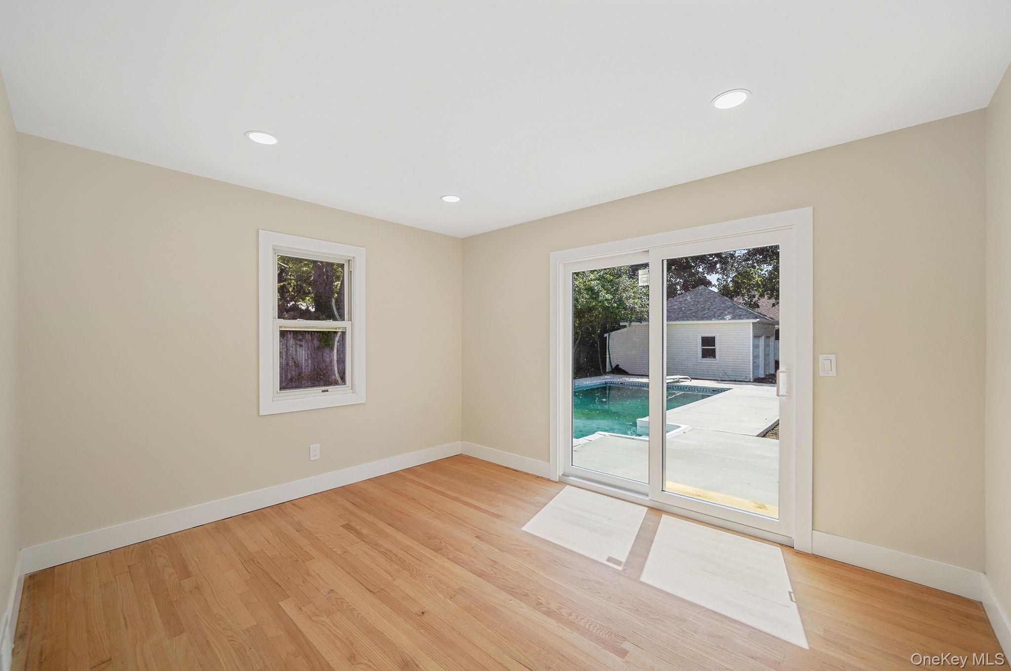 48 Vernon Street Patchogue, NY 11772 - Photo 14 of 31 Unfurnished room featuring recessed lighting and light wood-style flooring