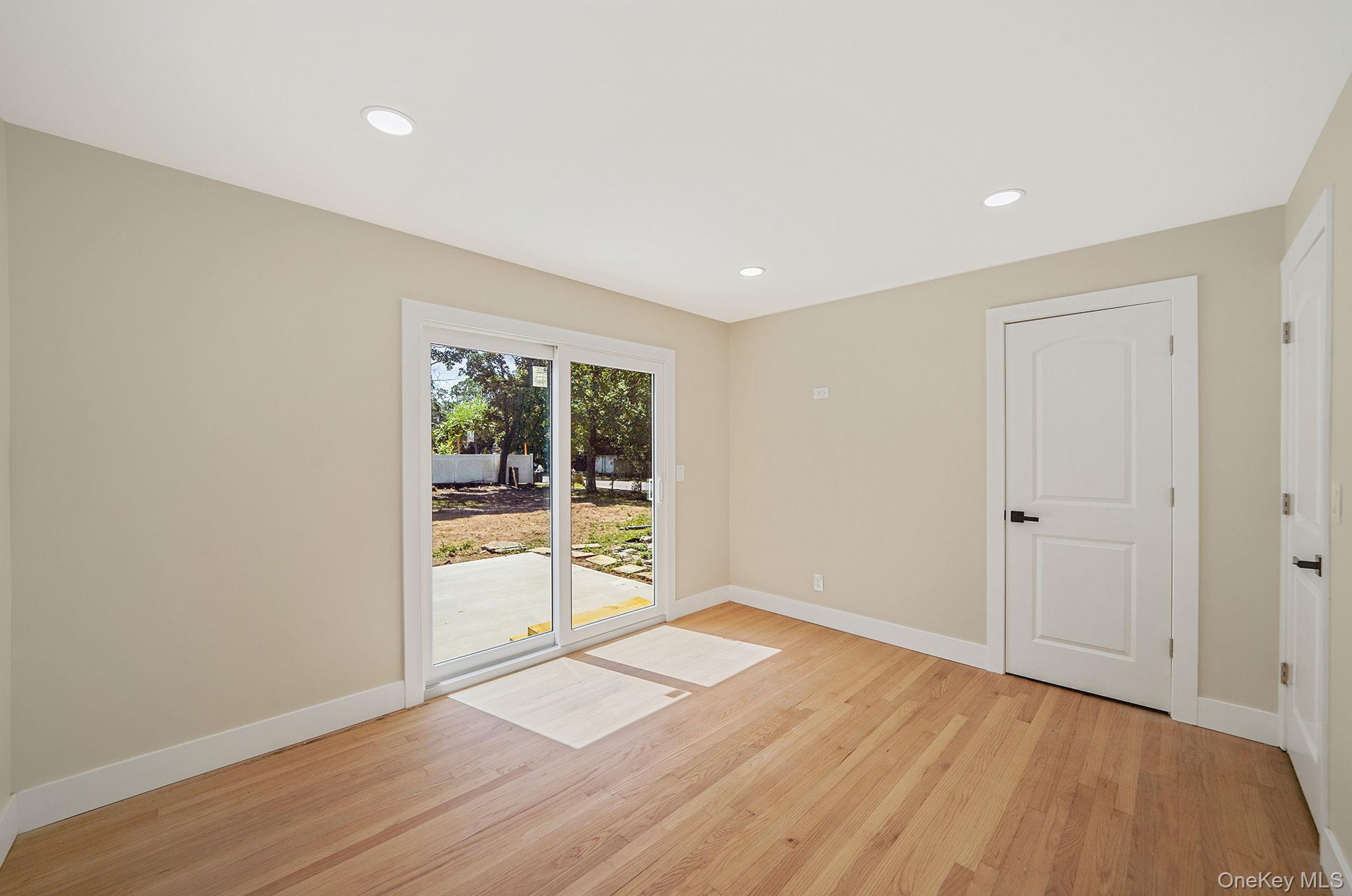 48 Vernon Street Patchogue, NY 11772 - Photo 15 of 31 Spare room featuring recessed lighting and light wood-style floors
