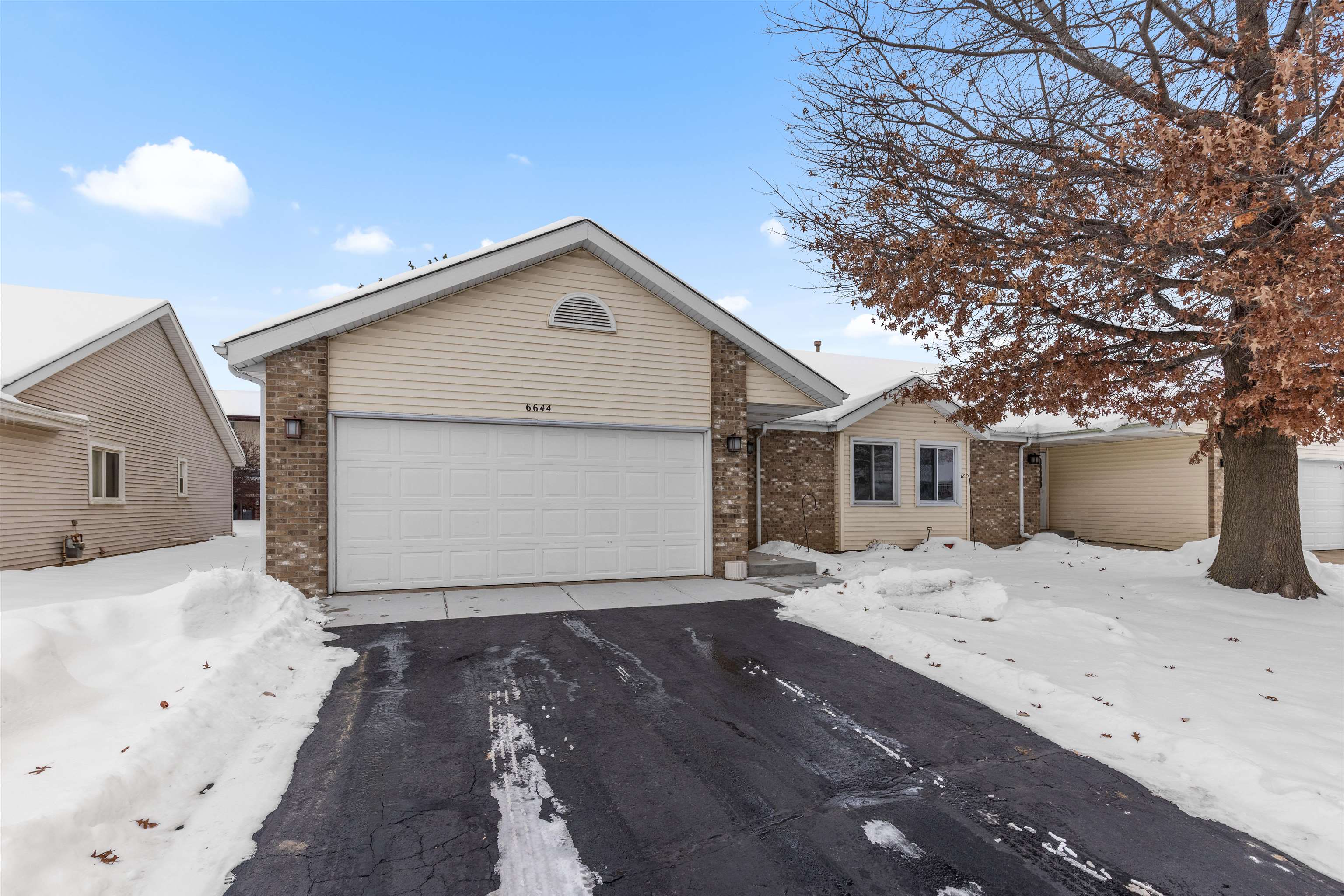 6644 North Point Road Rockford, IL 61108 - Photo 2 of 19 a front view of a house with a yard