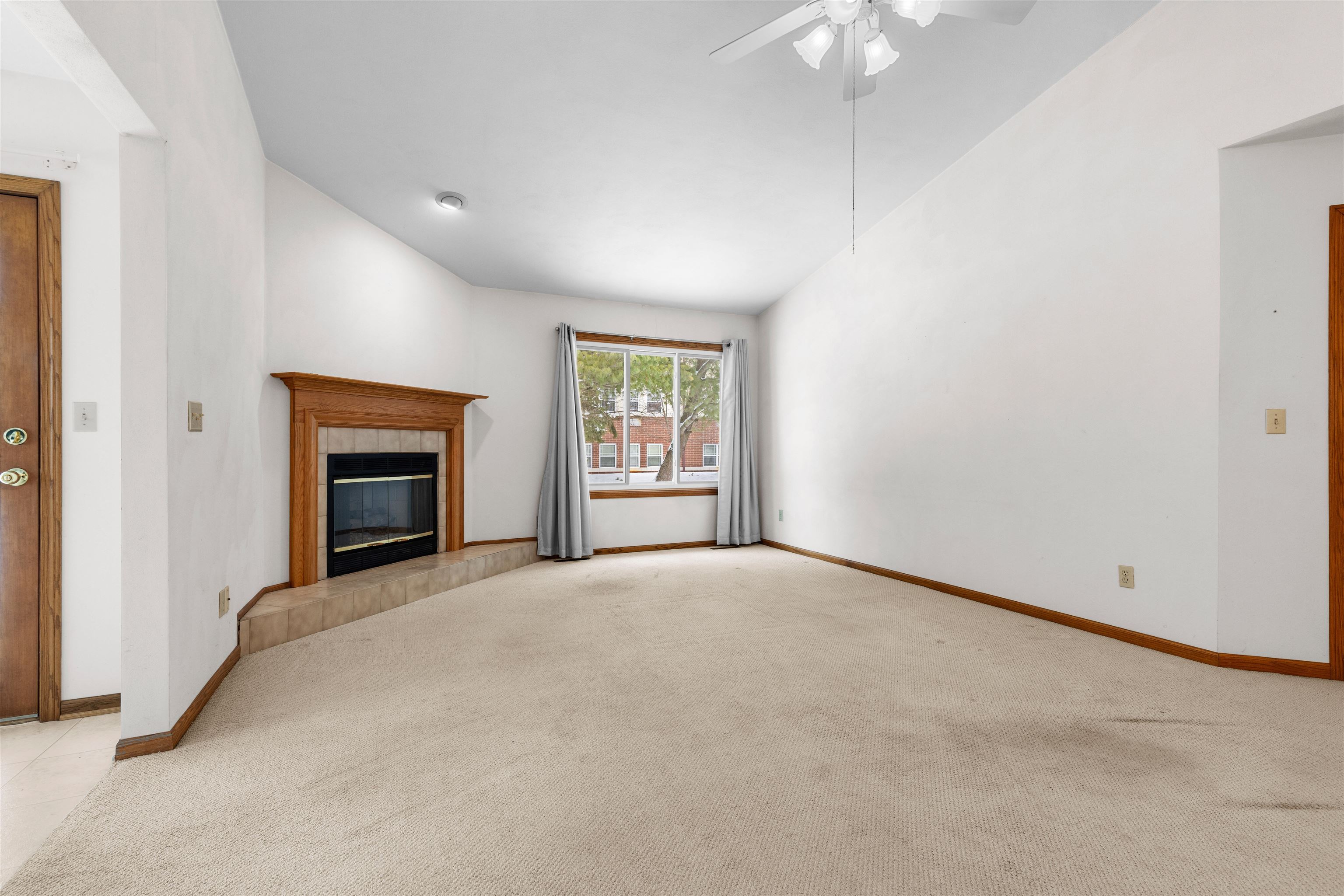 6644 North Point Road Rockford, IL 61108 - Photo 4 of 19 an empty room with windows and fireplace