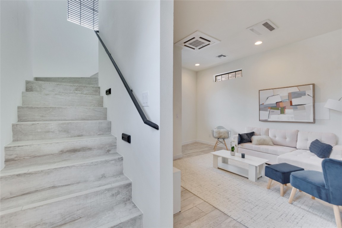 808 Lydia Street Austin, TX 78702 - Photo 14 of 40 a living room with furniture and stairs