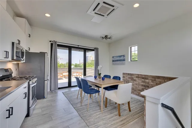 a dining room with furniture and window