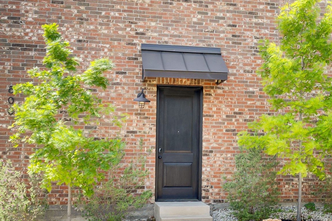 808 Lydia Street Austin, TX 78702 - Photo 33 of 40 a brick house with a tree in front of it
