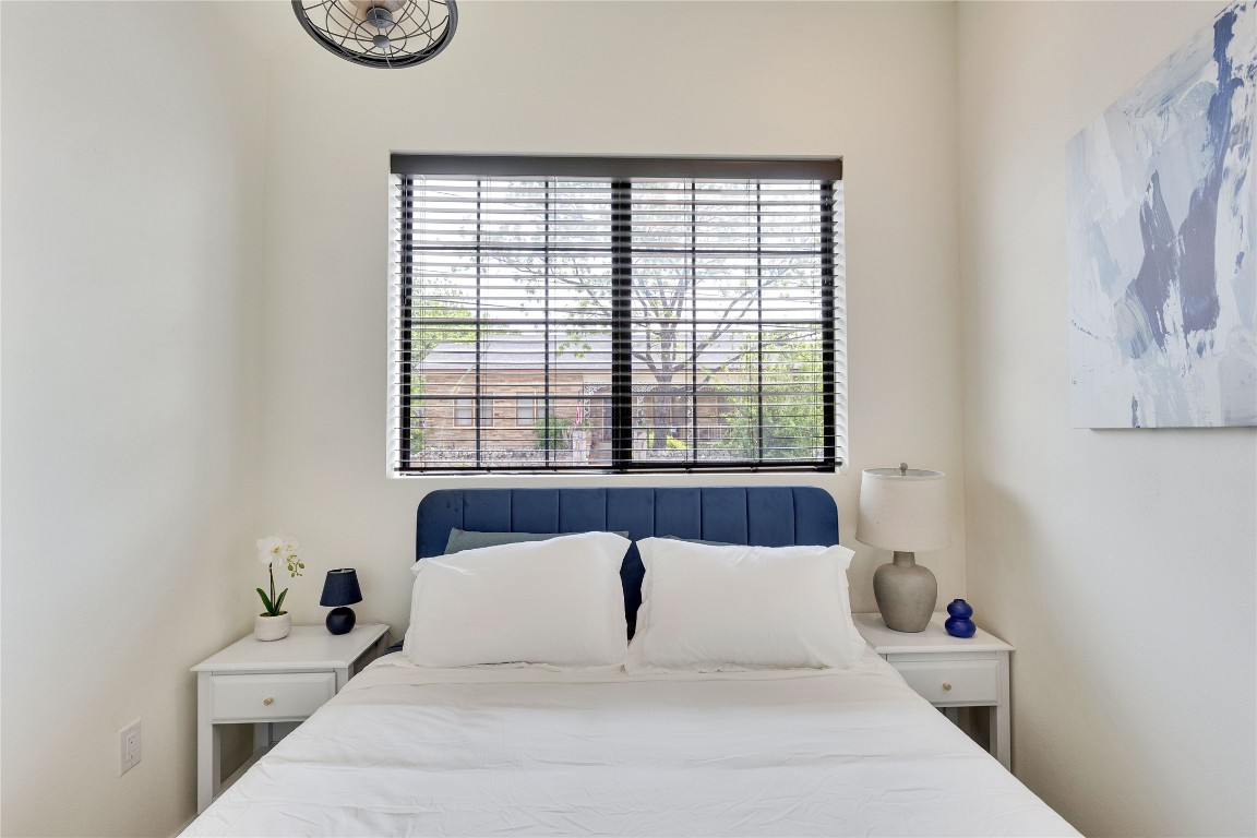 808 Lydia Street Austin, TX 78702 - Photo 35 of 40 a bedroom with a bed and a window