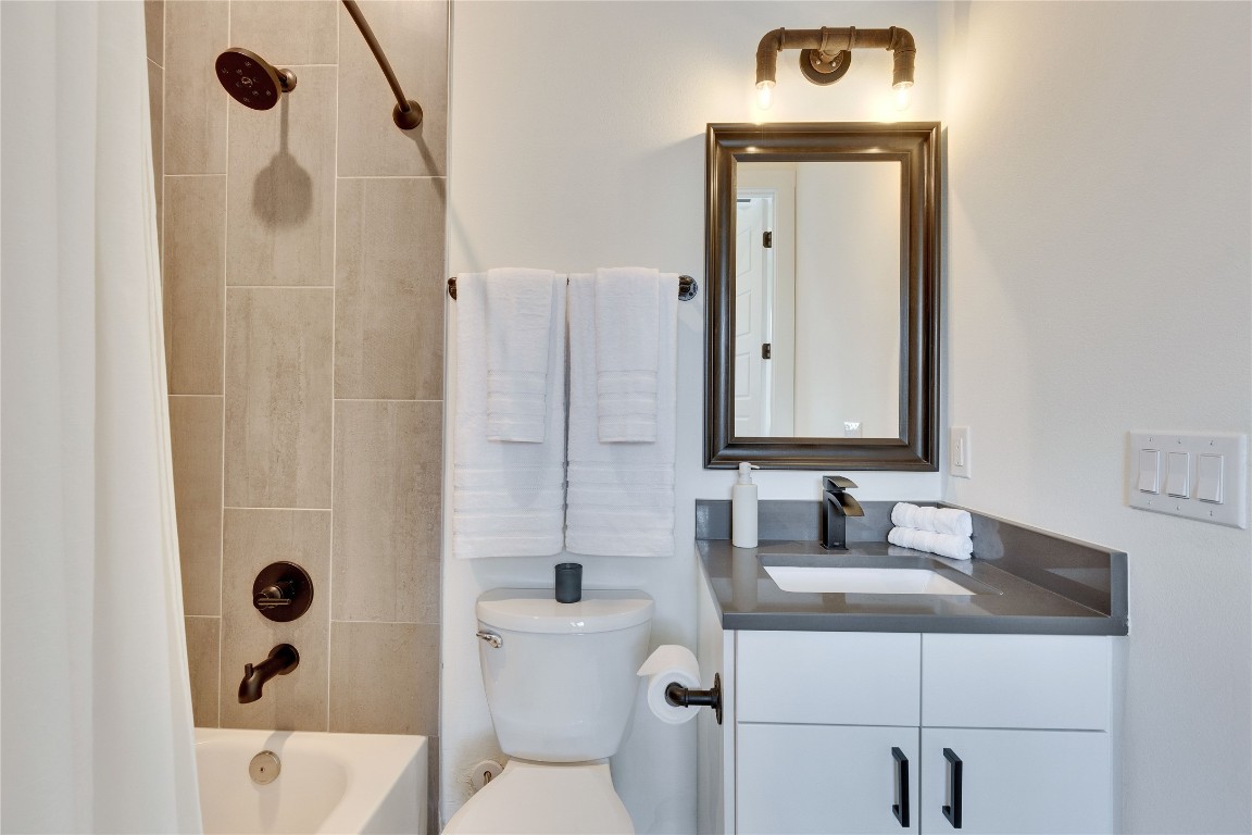 808 Lydia Street Austin, TX 78702 - Photo 37 of 40 a bathroom with a sink a toilet and shower