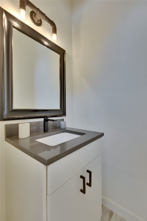 808 Lydia Street Austin, TX 78702 - Photo 6 of 40 a bathroom with a granite countertop sink and a mirror