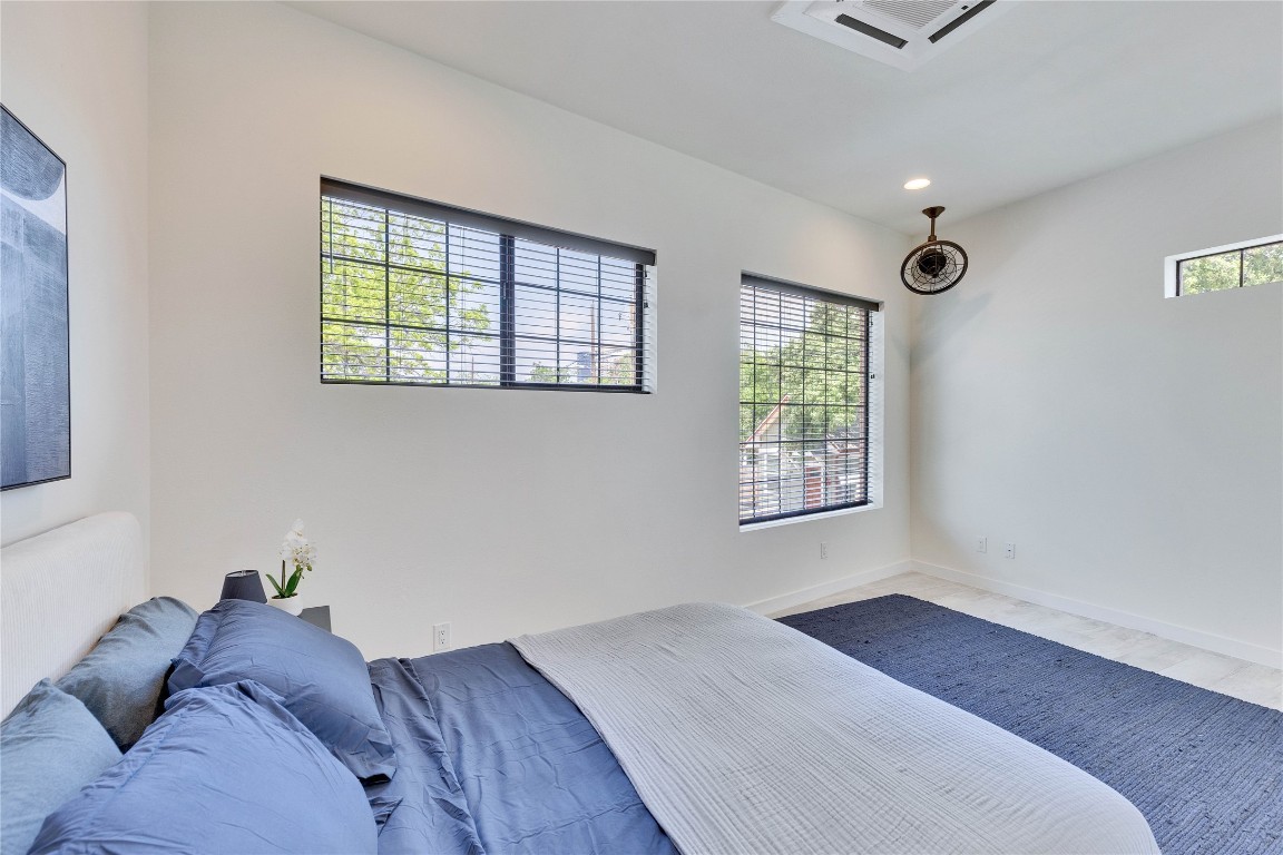808 Lydia Street Austin, TX 78702 - Photo 10 of 40 a bedroom with a bed and a window