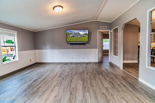a view of a porch with wooden floor