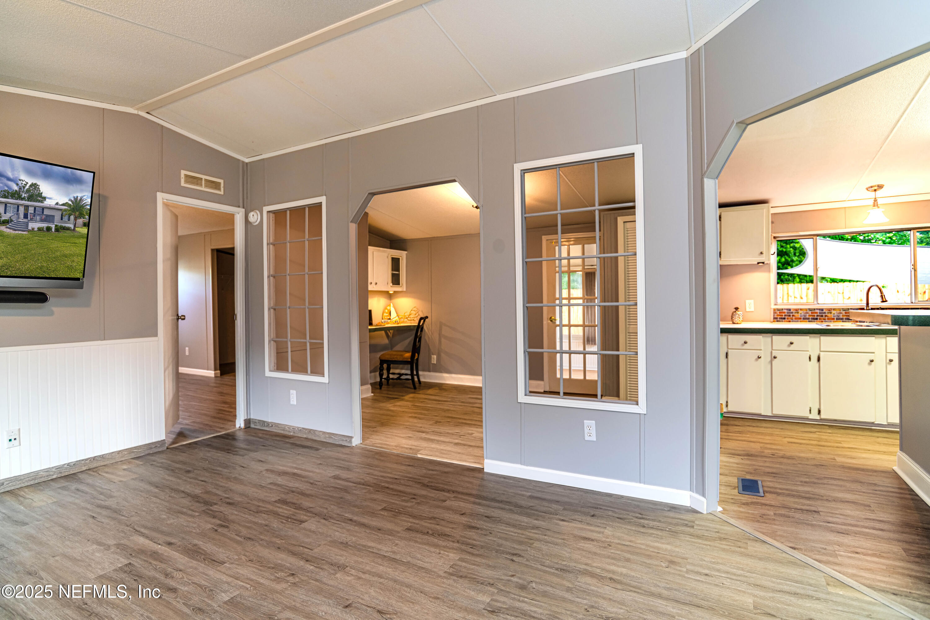 6681 Brown Road St. Augustine, FL 32095 - Photo 17 of 43 a view of a room with wooden floor and windows