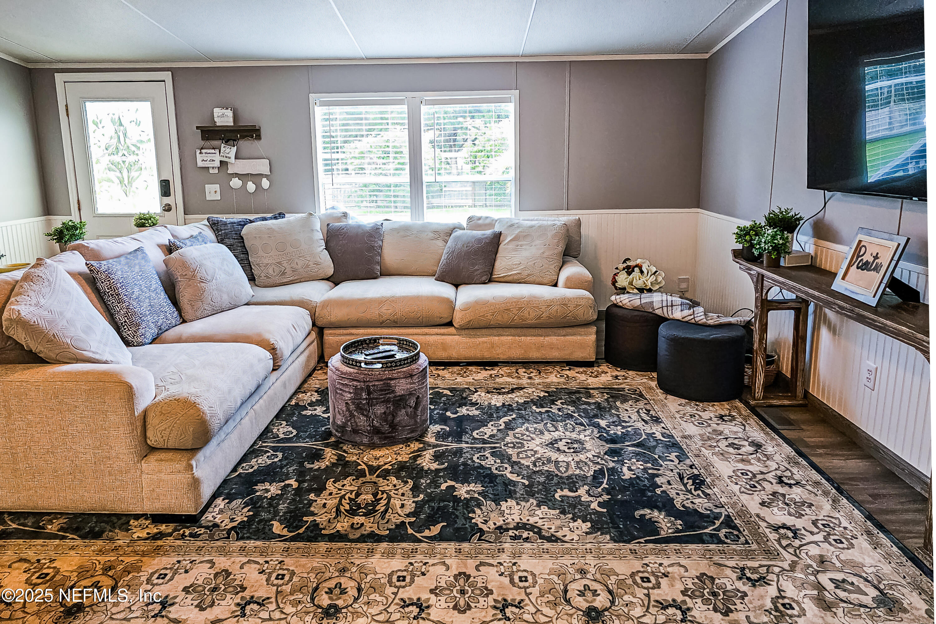 6681 Brown Road St. Augustine, FL 32095 - Photo 18 of 43 a living room with furniture and a couch