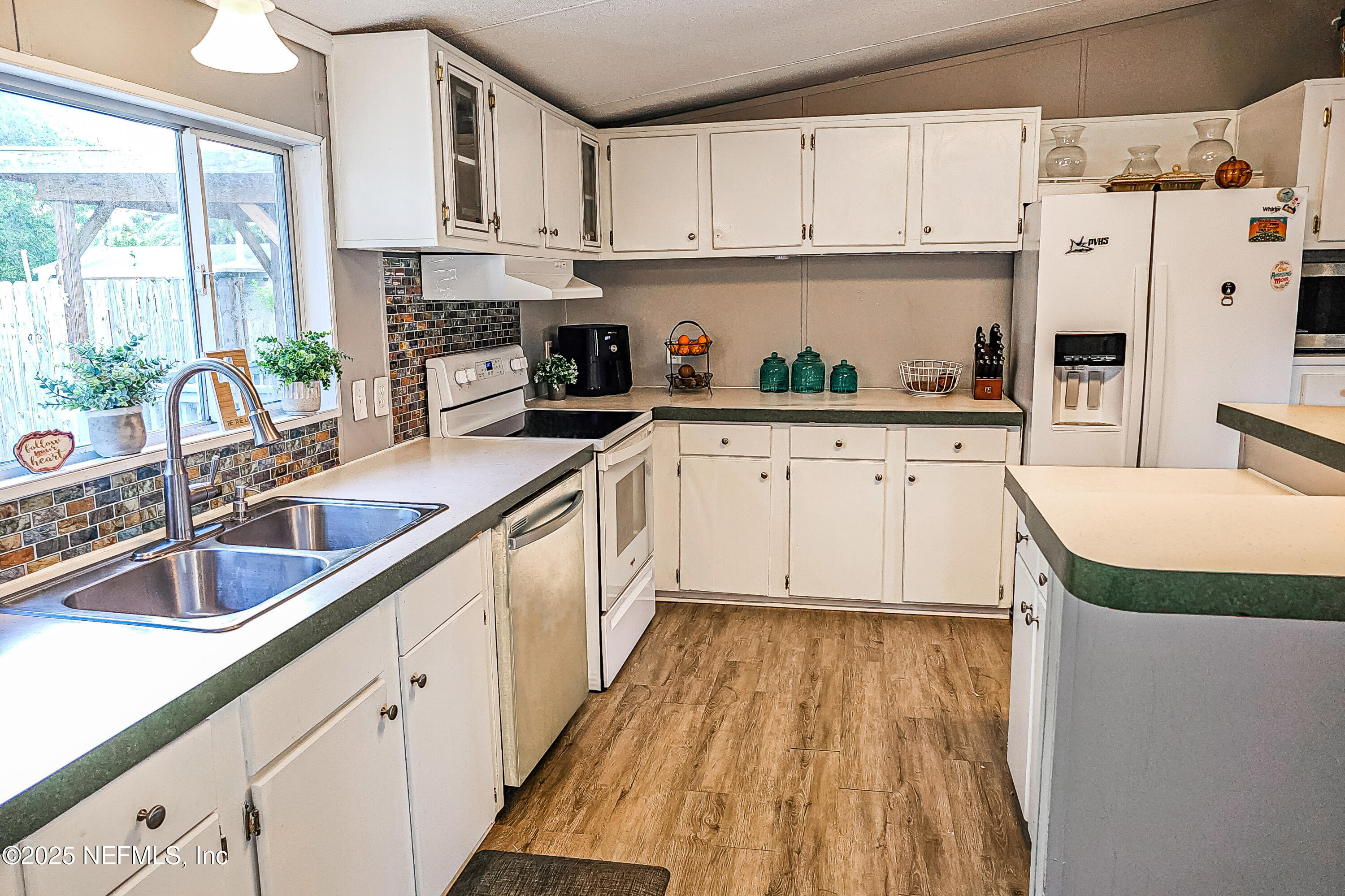 6681 Brown Road St. Augustine, FL 32095 - Photo 20 of 43 a kitchen with cabinets appliances and a sink