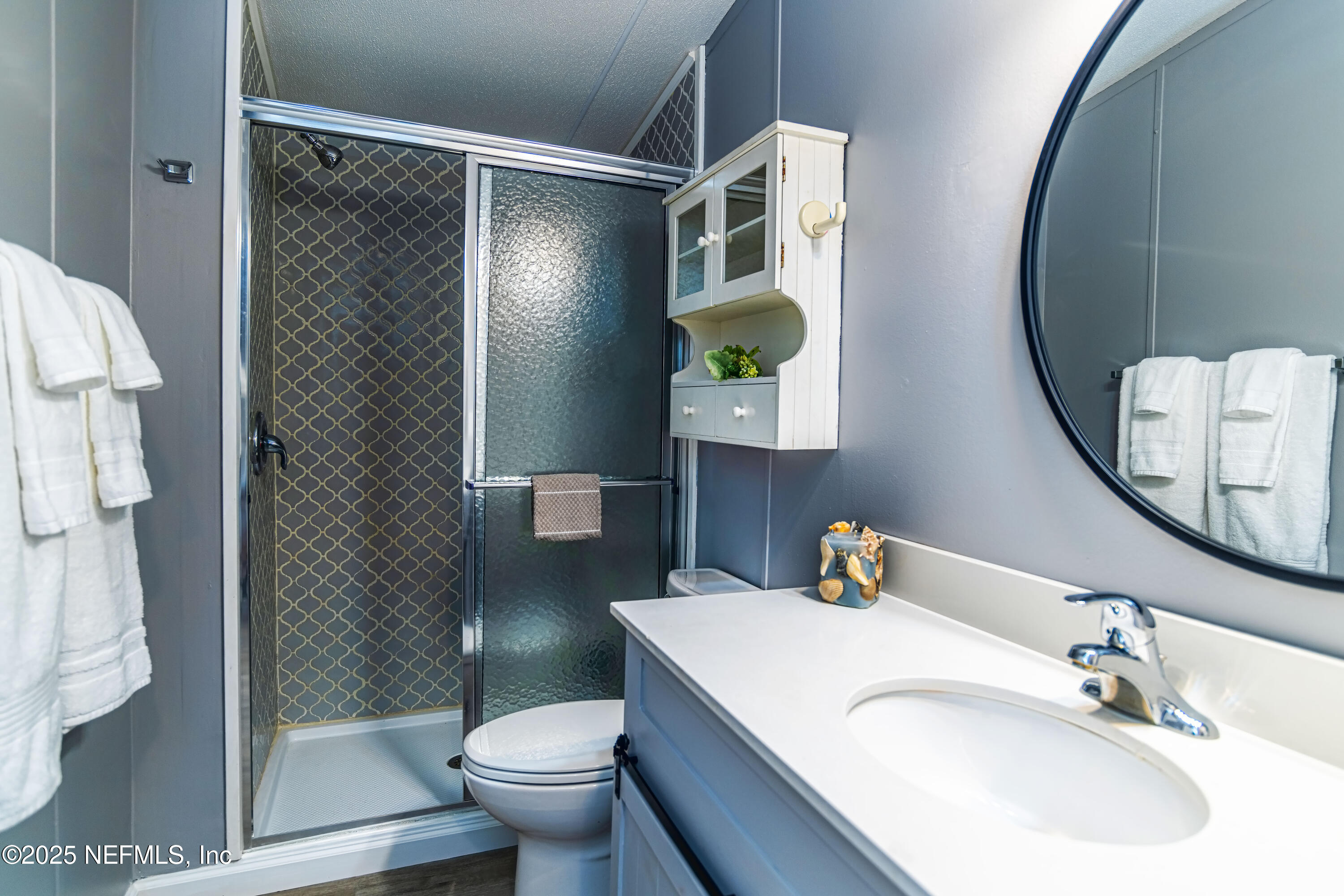 6681 Brown Road St. Augustine, FL 32095 - Photo 28 of 43 a bathroom with a sink toilet and shower