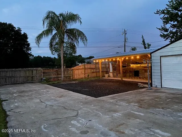a view of house with patio and wooden floor