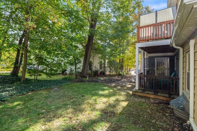 a view of a house with backyard and garden