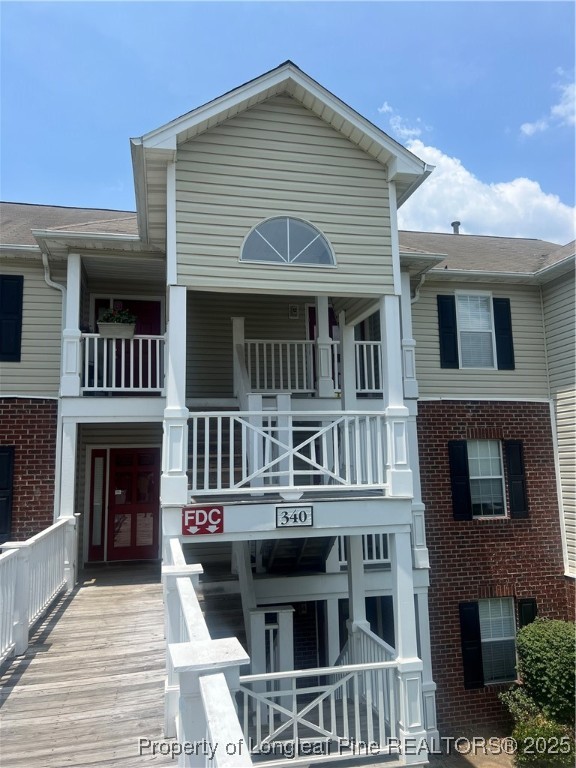 a front view of residential houses with stairs