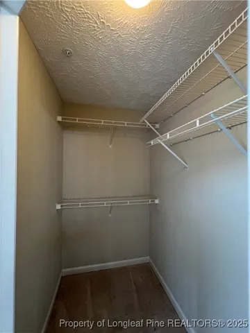 a view of a room with racks on the wall