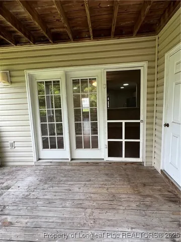 a view of empty room with a large window