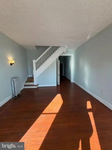 a view of an empty room with stairs