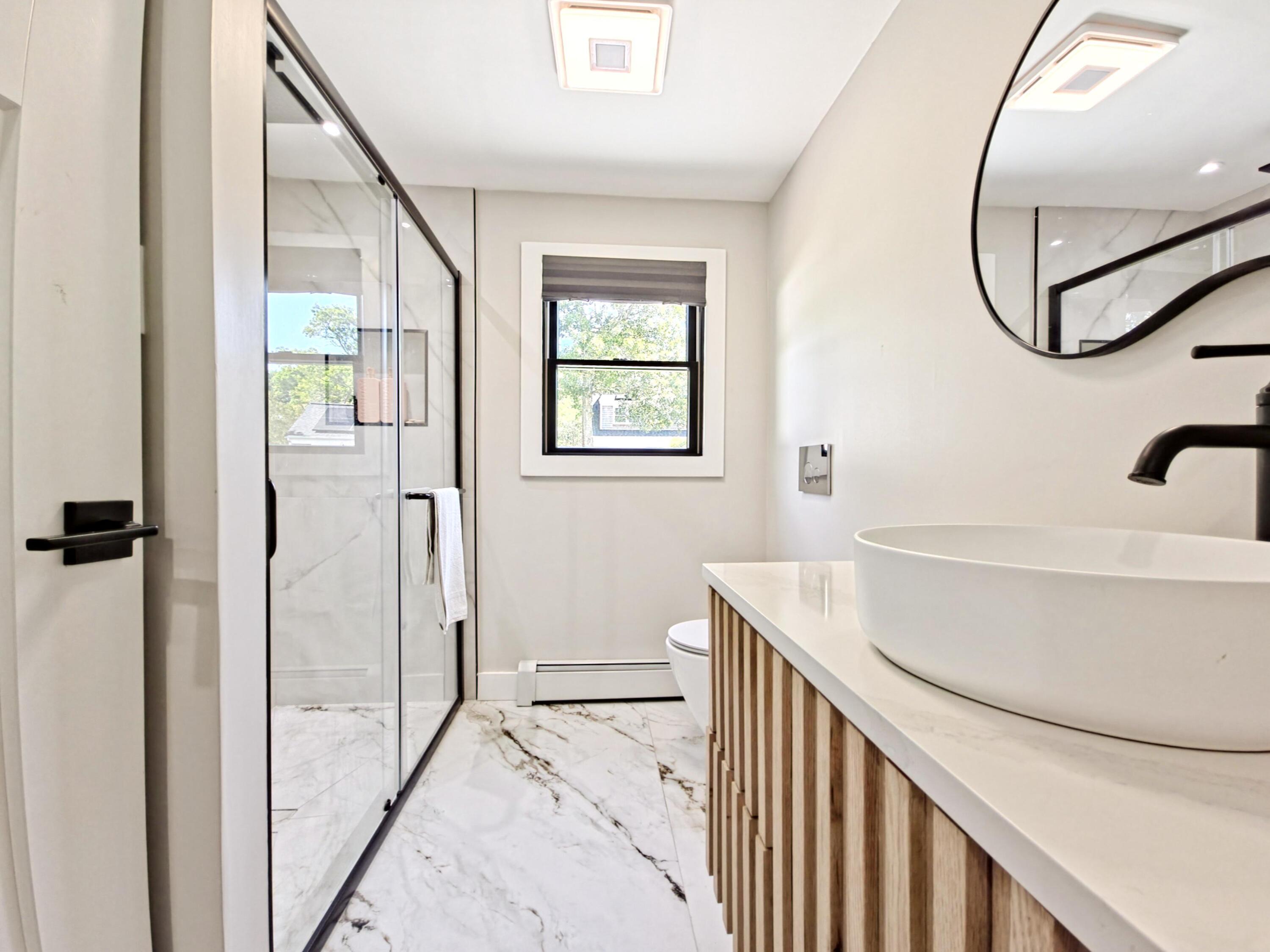 22 Keel Way Hyannis, MA 02601 - Photo 12 of 42 a bathroom with a sink and a mirror