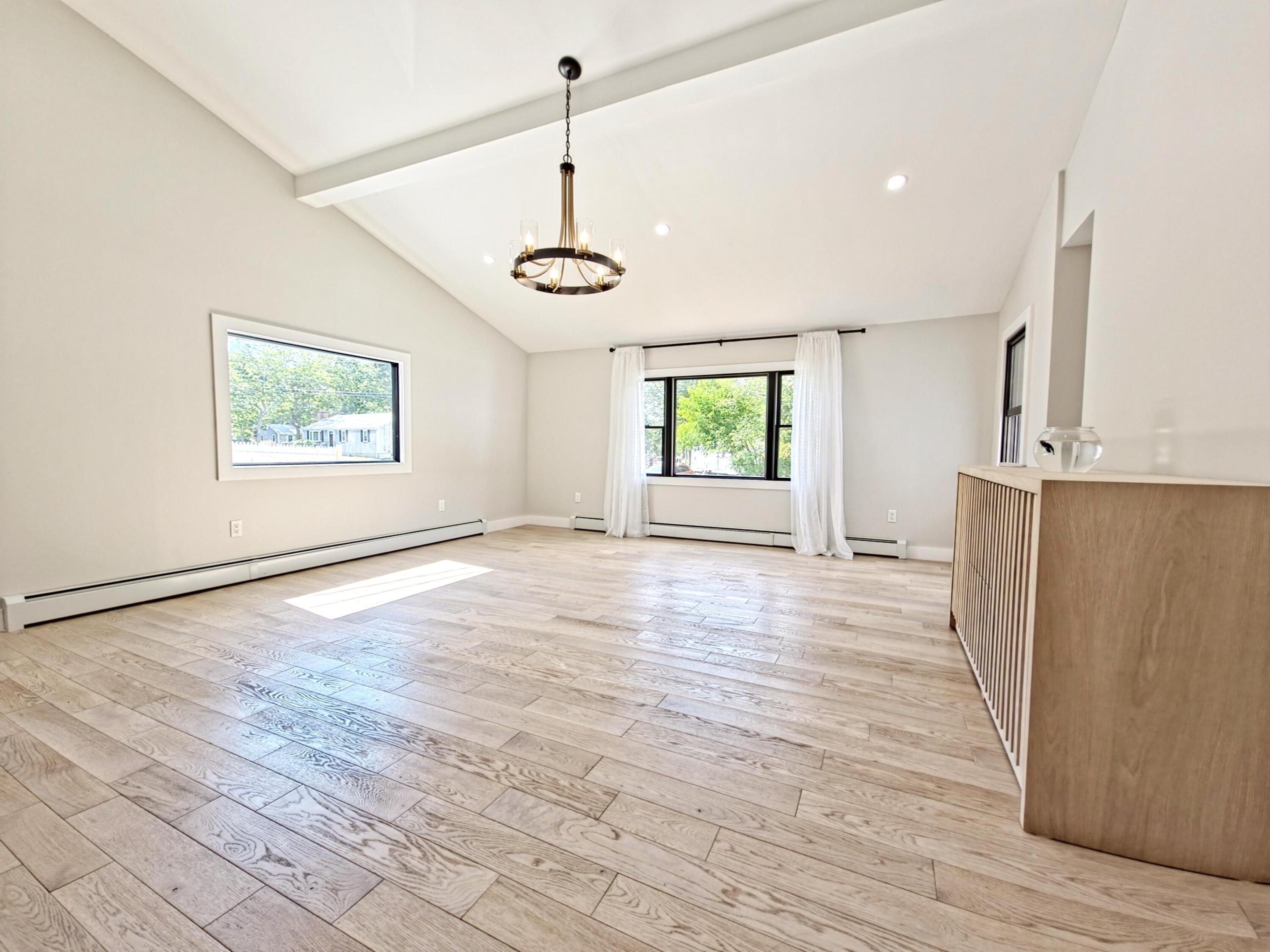 22 Keel Way Hyannis, MA 02601 - Photo 15 of 42 a view of an empty room with a window and wooden floor