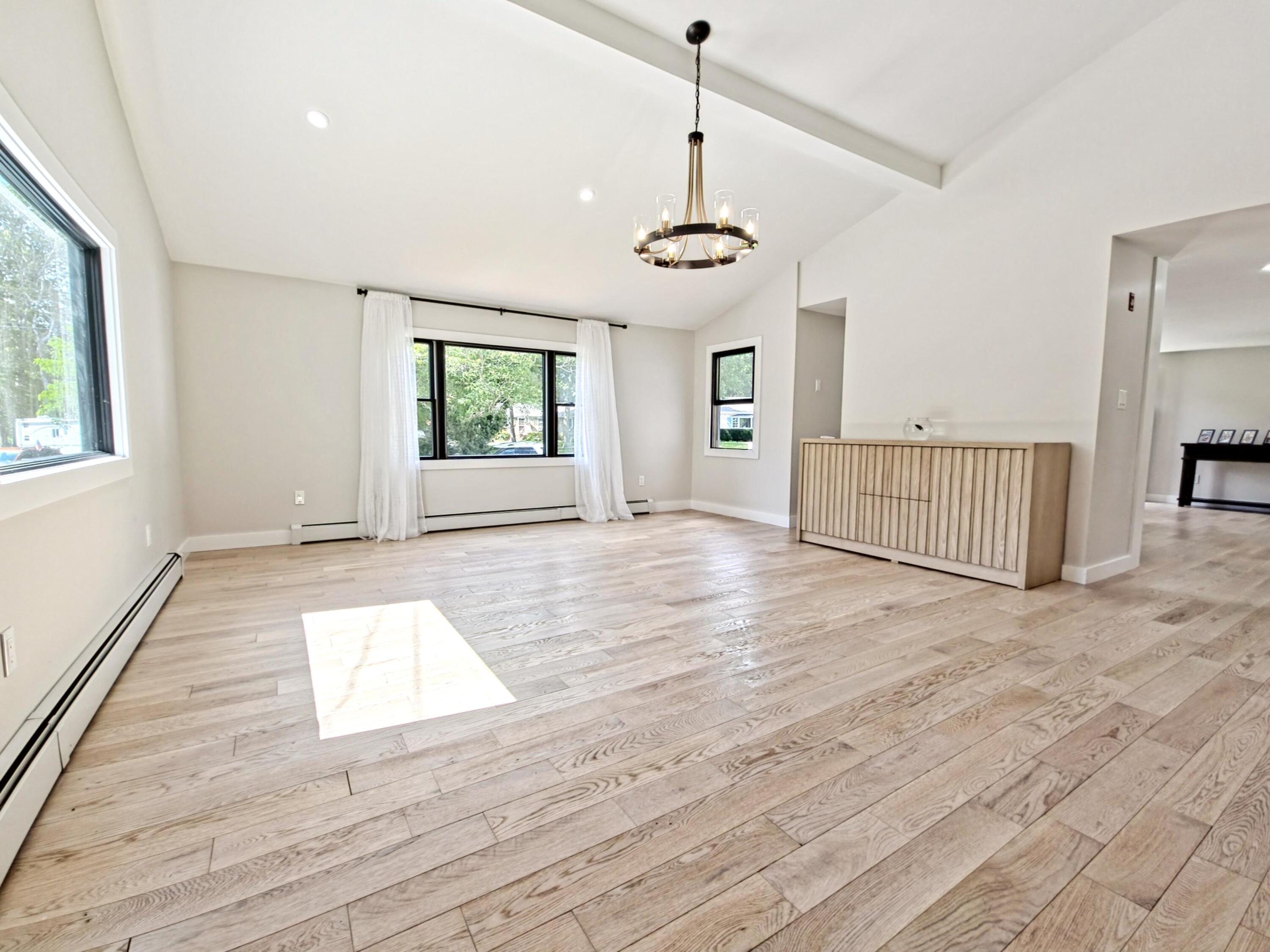 22 Keel Way Hyannis, MA 02601 - Photo 16 of 42 a view of an empty room with wooden floor and a window