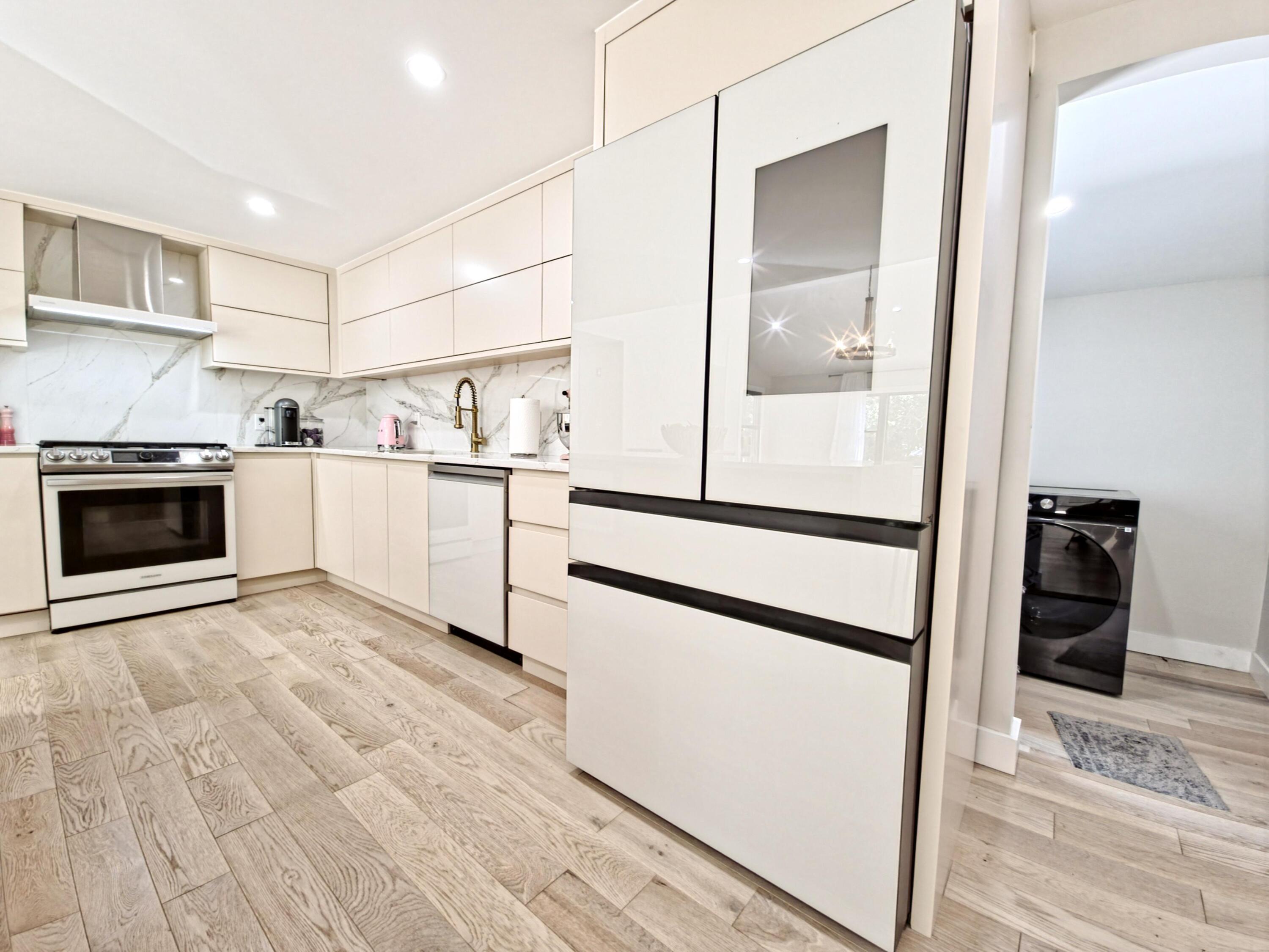 22 Keel Way Hyannis, MA 02601 - Photo 19 of 42 a kitchen with stainless steel appliances granite countertop a refrigerator and a stove top oven