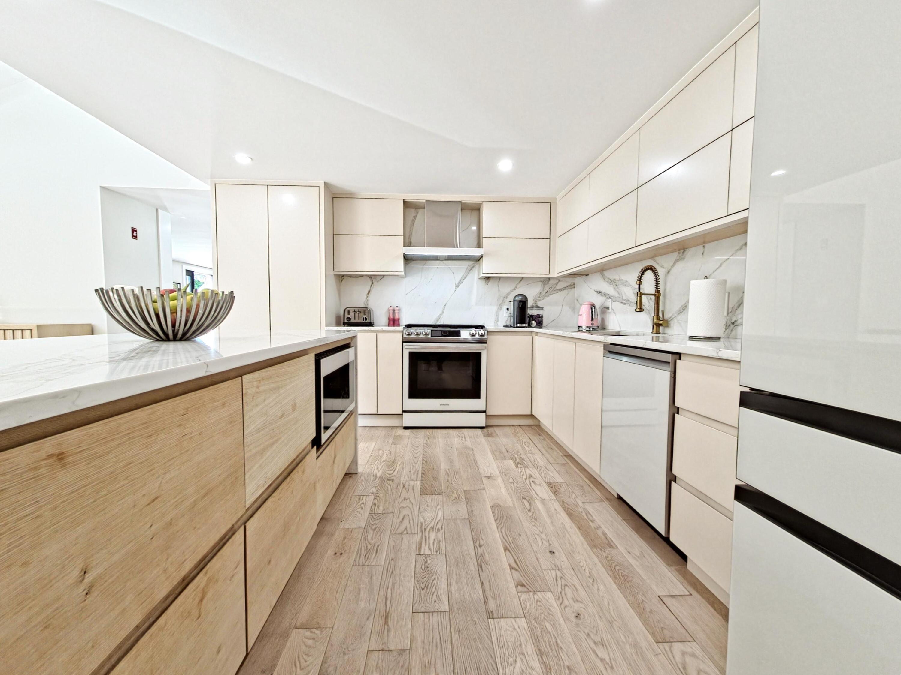 22 Keel Way Hyannis, MA 02601 - Photo 20 of 42 a kitchen with stainless steel appliances granite countertop a sink and cabinets