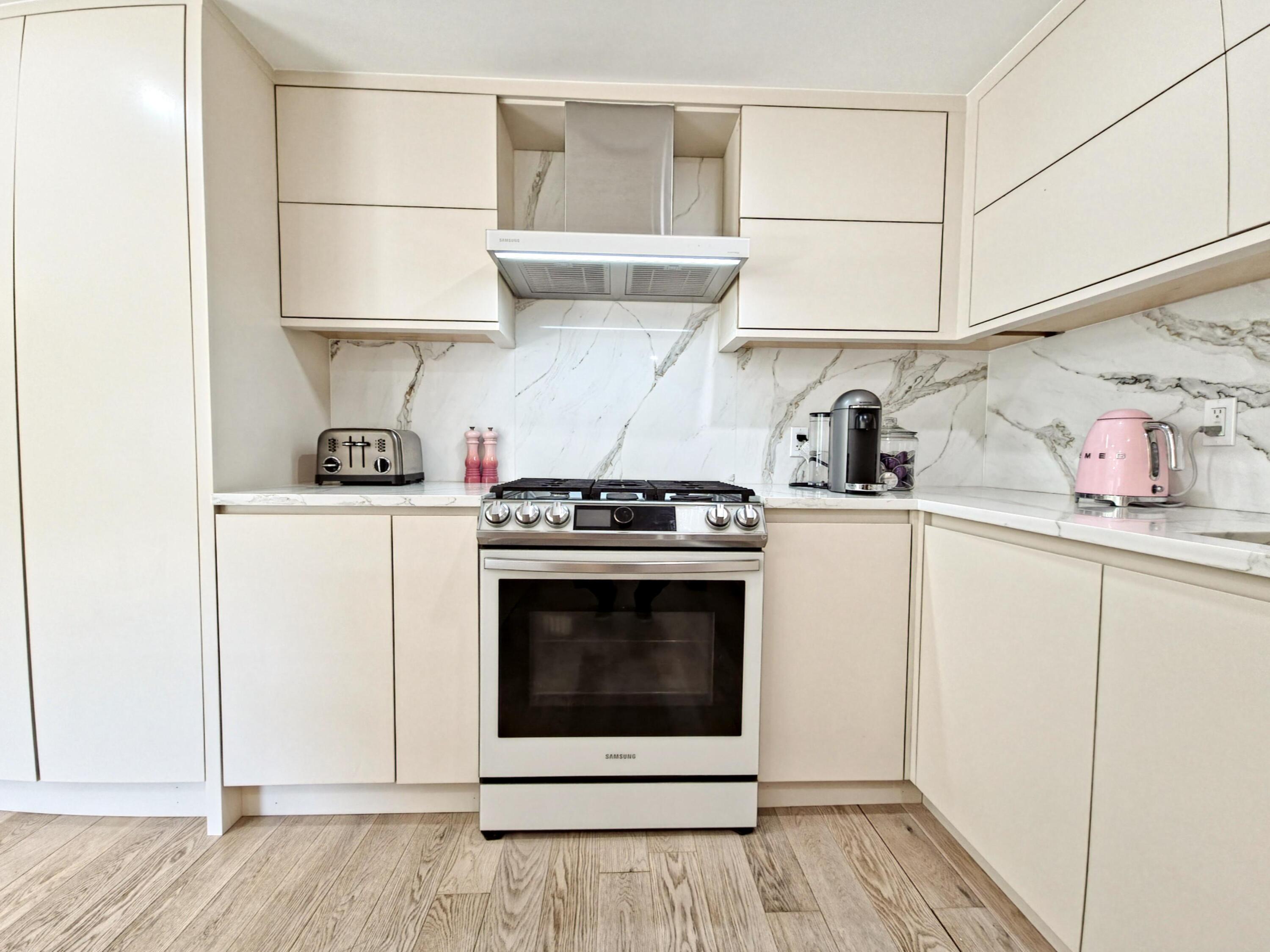 22 Keel Way Hyannis, MA 02601 - Photo 21 of 42 a kitchen with stainless steel appliances a white stove top oven and sink